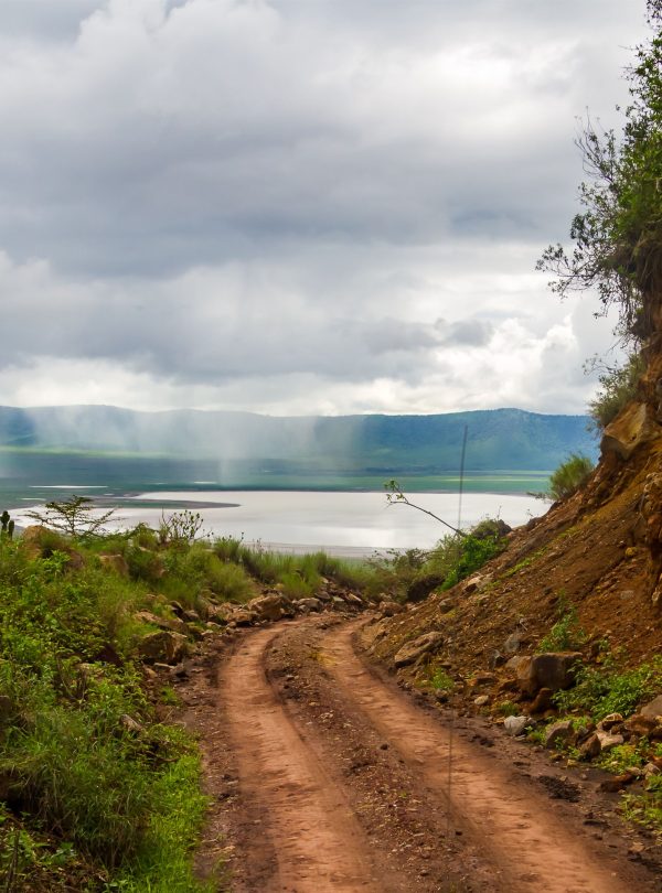 Mountain road in the cloudy Ngorongoro Crater landscape
